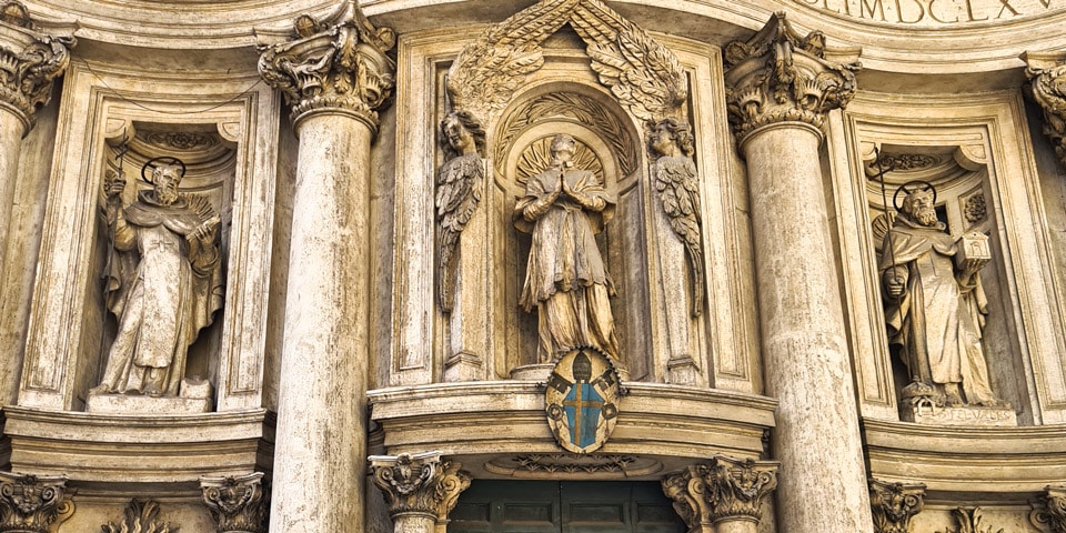 On either side Saint John of Matha and Saint Felix of Valois the founders of the Trinitarian Order