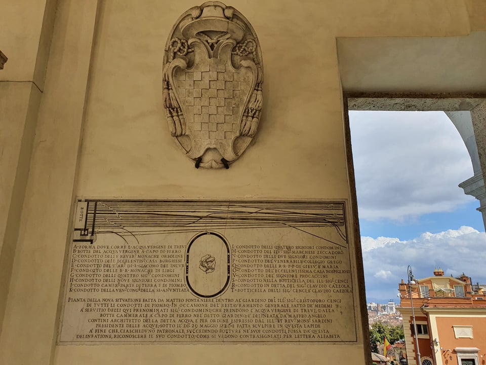 1720 marble map of Acqua Vergine water rights and lead pipe distribution mounted on the wall of the Acqua Paola fountain, Rome