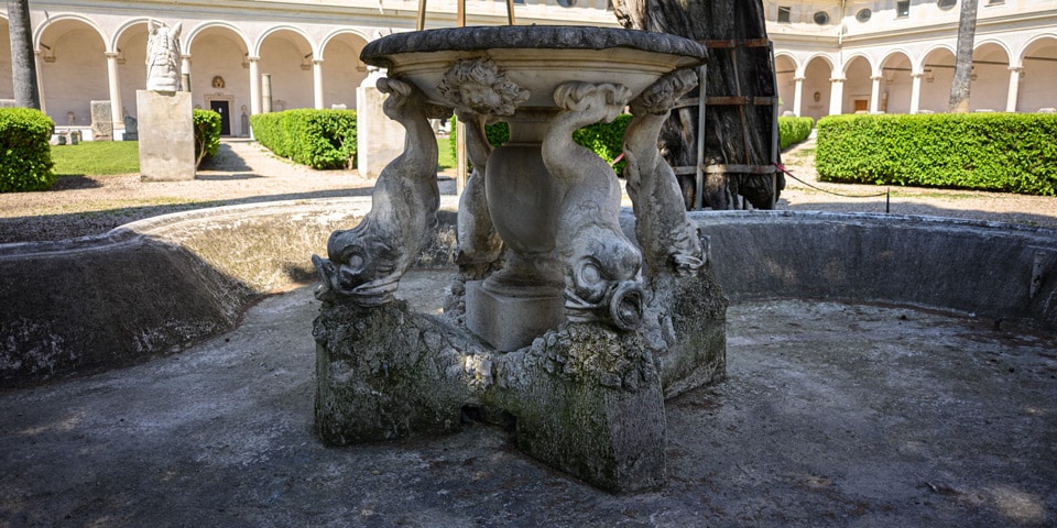 The 1695 dolphin fountain at the centre of the Great Cloister of the Baths of Diocletian, Rome