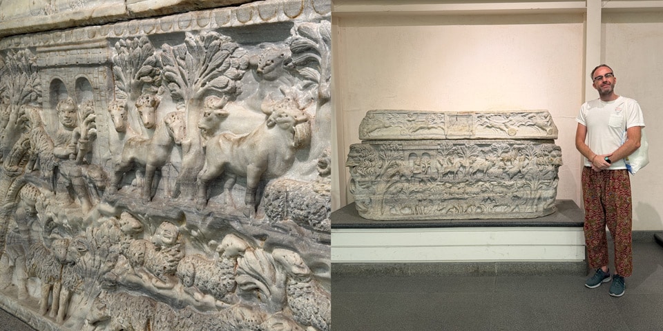 Artur Jakucewicz beside a Roman marble sarcophagus with pastoral scenes (c. AD 270) at the Baths of Diocletian museum, Rome