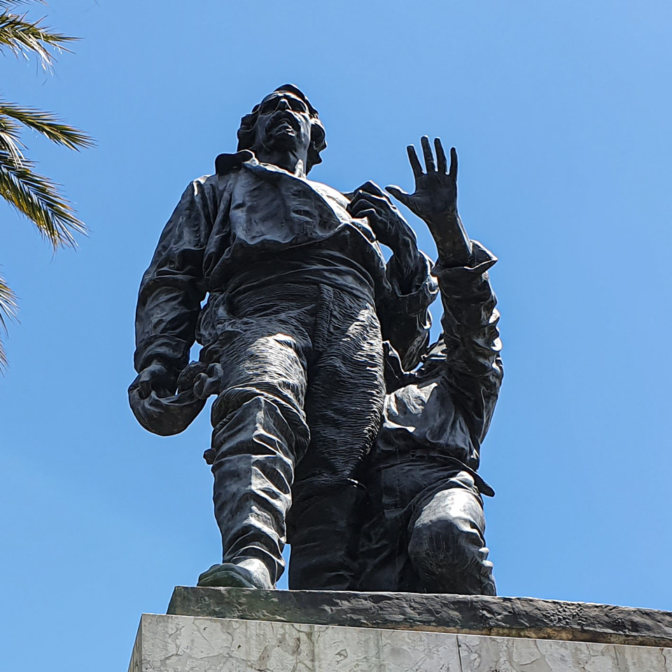 Close view of Ciceruacchio baring his chest as his son Lorenzo stands behind him