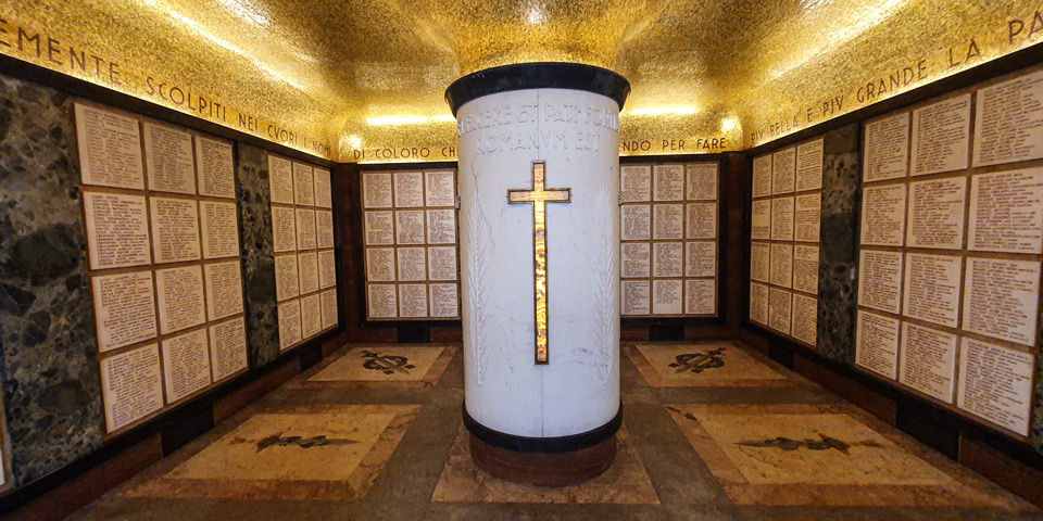 Memorial name plaques beneath the gold mosaic ceiling inside the Garibaldi Ossuary crypt in Rome