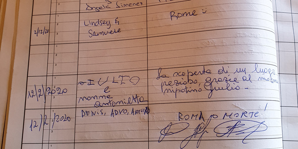 Handwritten messages and signatures in the visitor book at the Garibaldi Ossuary Mausoleum in Rome