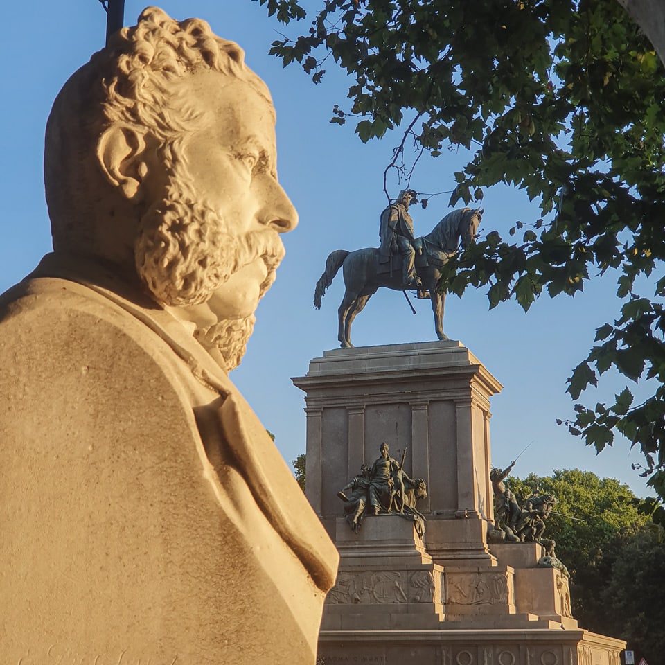 Bust of Nicola Fabrizi with the Giuseppe Garibaldi Monument in the background on Janiculum Hill in Rome
