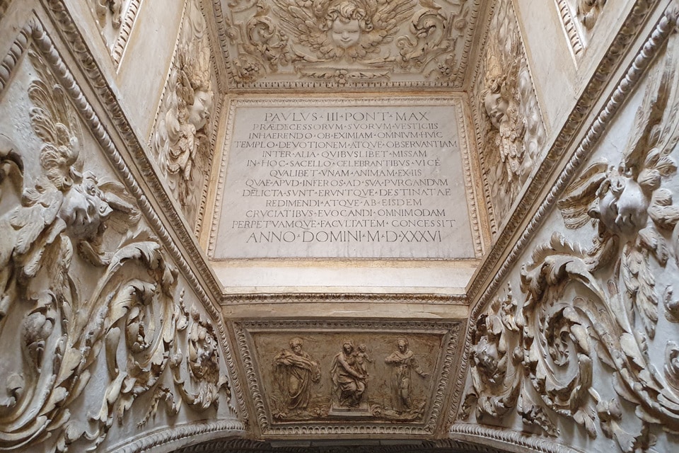 Latin inscription recording Pope Paul III's 1536 privilege in the light shaft above the Tempietto crypt