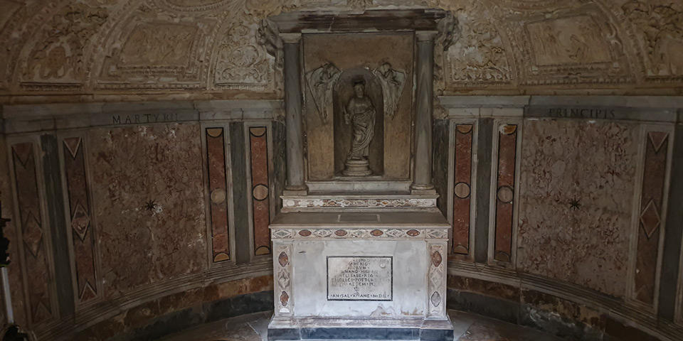 Underground crypt of Bramante's Tempietto with its altar, Saint Peter statue and 1502 foundation inscription