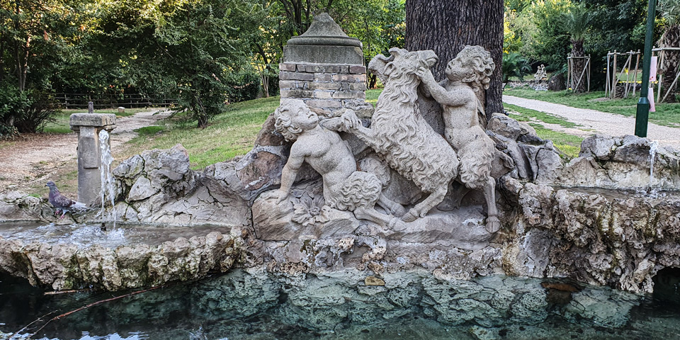 Young satyrs playing with a goat in a rockwork fountain at Villa Sciarra in Rome